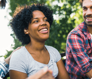 Smiling woman wearing hearing aids